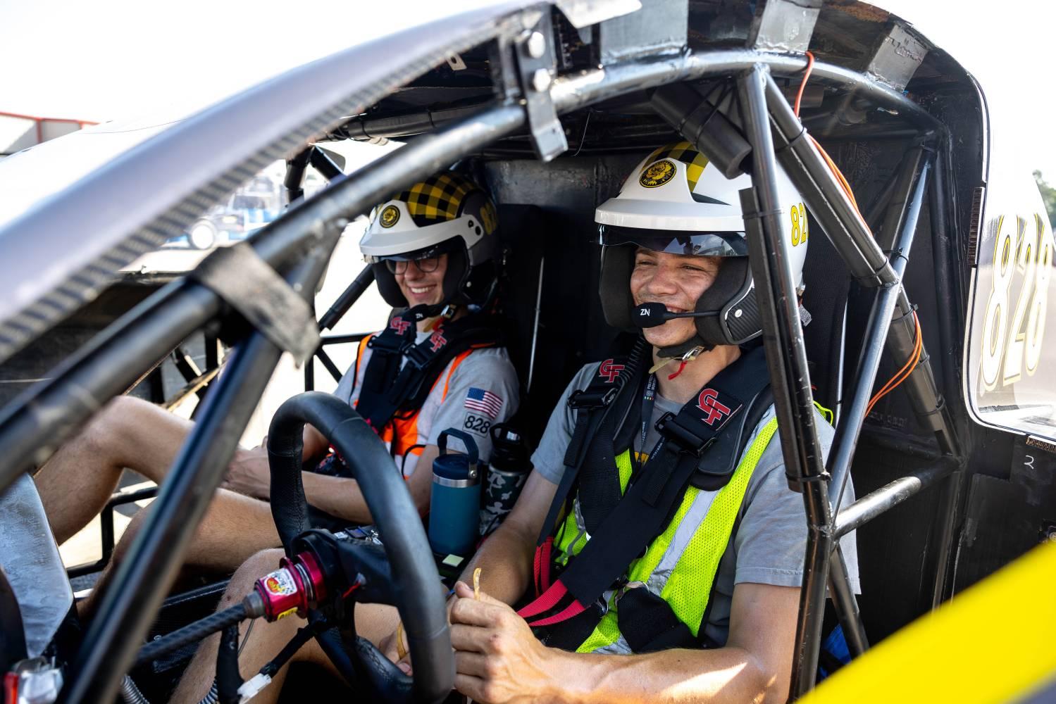 <p>Jonathan Linderich (left) with his team mate in the racing car © Linderich/Team Sunergy</p>