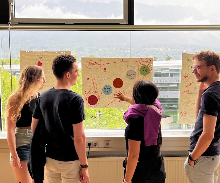 <p>Students presenting their posters. Photo: Mark Reyes</p>